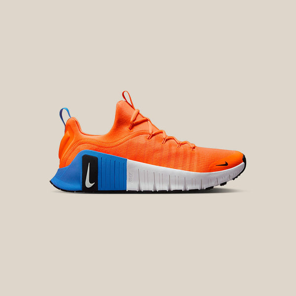 nike training metcon trainers in white and orange